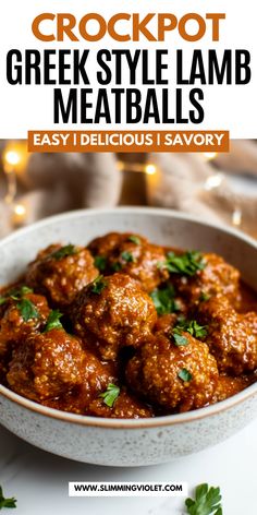 a white bowl filled with meatballs and garnished with parsley on top