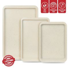 three white trays with red labels on them