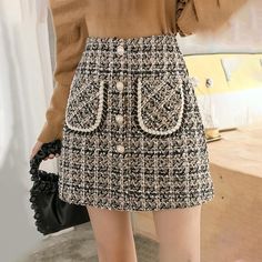 Silhouette: Pencil Gender: WOMEN Waistline: Empire Pattern Type: Plaid Material: Acetate, Cotton, Polyester Style: Elegant color: Black, Khaki Size: S,M,L,XL Length: Mini Skirts Size (cm) Waist Width Hip Width Skirt Length S 64.0 84.0 36 M 68.0 88.0 37 L 72.0 92.0 38 XL 76.0 96.0 39 Size (inch) Waist Width Hip Width Skirt Length S 25.20 33.07 14.17 M 26.77 34.65 14.57 L 28.35 36.22 14.96 XL 29.92 37.80 15.35