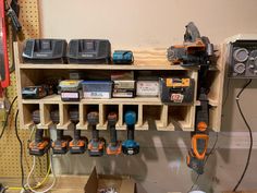 a workbench with many tools on it, including drillers and screwdrivers