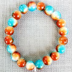 Brand New Handmade Ethnic Round Ball Blue And Orange Crackle Crystal Quartz Stretchy Bracelet. Collage Items, Orange Accessories, Unisex Bracelets, Stretchy Bracelets, Blue And Orange, Crystal Quartz, Stretch Bracelets, Womens Jewelry Bracelets, Blue Orange