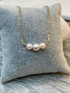 "7-7.5mm and 5-5.5mm White rose tone Akoya Culture Pearl (from Japan) in 14K Gold filled or Serling silver chain Beautiful Elegant and Classic look. Perfect gift for any occasion Holidays, Birthday or just something nice as a gift ◈ Handmade in the U.S.A. ◈ Akoya Culture Pearl: 1 / 7-7.5mm and 2 / 5-5.5mm white rose tone pearls ◈ Metal: 14K gold filled or sterling silver ◈ Chain Length:15\" 16\" 17\" 18\" 19\" 20\" free shipping and a gift 🎁 My jewelry will be wrapped in a beautiful gift box re Rose Gold Pearl Necklace With Round Beads For Gift, Rose Gold Akoya Pearl Necklace Gift, Pearl Bar Necklace, Necklace Friendship, Bar Necklaces, Akoya Pearl Necklace, Rose Tone, Cultured Pearl Necklace, Black Bead Necklace