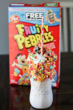 an ice cream sundae with sprinkles and candy