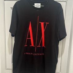 Armani Exchange Icon Period T Shirt With Big Logo In The Front. Never Worn Before And Is Limited Edition Of The Icon Period T Shirts They Make At Armani. Brand New And Clean. It’s A More Fitted Shirt Than Baggy Keep In Mind Red Short Sleeve Tops With Logo, Red Crew Neck Top With Logo, Black Casual T-shirt With Logo, Casual Short Sleeve Shirt With Logo, Casual Red Tops With Logo, Casual Short Sleeve Logo Top, Tan Short Sleeve Top With Logo Print, Black Logo Top With Short Sleeves, Tan Crew Neck Shirt With Logo Print