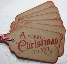 four tags with merry christmas written on them