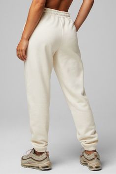 Cozy Fleece Go-To Sweatpant Fabletics Oatmeal Heather female Fleece regular Everyday/Lounge Cozy Fit Bottoms With Elastic Waistband, Elastic Waistband Cozy Bottoms, Soft Bottoms With Cozy Fit, Cozy Soft Bottoms With Cozy Fit, Cozy Fit Bottoms For Relaxation, Cozy Bottoms With Soft Texture For Leisure, Cozy Cream Sweatpants With Relaxed Fit, Cozy Cream Relaxed Fit Sweatpants, Cozy White Bottoms For Relaxation