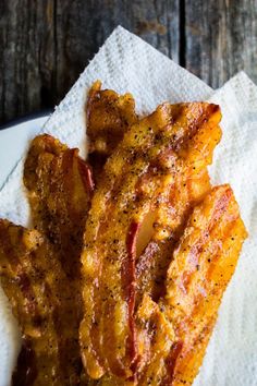 three pieces of fried chicken on a napkin