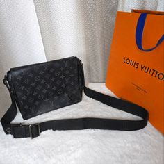 Very Good Used Condition Louis Vuitton District Messenger Bag Monogram Eclipse Canvas Mm. 12"W X 11"H X 3"D 10-20 Strap Drop. Coated Canvas Material Silver Hardware Fabric Interior Material Rfid Response Condition: Overall Very Good Condition, Some Callouts Are Shown In Pictures. The Hardware Logo In The Front Was Painted, Some Rubbing On The Sides And Corners, Some Cologne Odor (Not Bad Or Storage, Just Men's Cologne). Please Manage Expectations, This Is A Used Item With Some Signs Of Use! Plea Men's Cologne, Hardware Logo, Not Bad, Mens Cologne, Silver Hardware, Canvas Material, Messenger Bag, 3 D, No Response