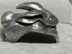 "For your consideration, a rare James Avery 3D rabbit ring. This whimsical ring which is hallmarked \"ster\" and the James Avery maker's which which is a candelabra and his initials.  This ring is 3D with a a tremendous amount of detail, down to his ears and fluffy tail. The rabbit measures  23.2mm x 12.6mm.and the band tapers to 5.5mm in the back. The rabbit stands a little over 12mm above the finger.  It is a size 8 and weighs in at a hefty 17.2 grams.  It is a unique and wonderful ring!" Whimsical Ring, 3d Rabbit, Rabbit Ring, Fluffy Tail, Silver Gift Wrap, Tulle Bows, Pink Sapphire Ring, The James, James Avery