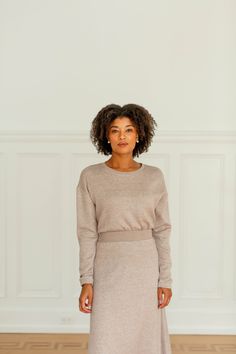 Easily transitioned from day to night, the 'Charlie' knit top is sure to become a staple in your closet this season! Incredibly soft, modest, and in a beautiful neutral shade, it can be paired with almost anything. Style it with the 'Charlie' knit midi skirt for a chic monochrome look! 45% Polyester, 40% Rayon, 15% Nylon Self 49% Rayon, 28% Polyester, 18% Nylon, 5% Spandex Contrast Hand Wash Cold Hang or Lay Flat to Dry Do Not Bleach Model Height 5'9" | Wearing Size Small Wearing the 'Charlie' D Knit Midi Skirt, Layered Tops, Knit Midi, Skirt Leggings, To Night, Knit Skirt, Blouse Dress, Tops For Leggings, Model Height