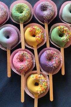 there are many doughnuts on the sticks with sprinkles in them