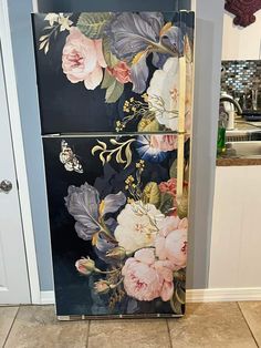 a floral painted refrigerator freezer in a kitchen