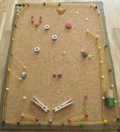 an overhead view of a play area made out of toys and beads on the floor