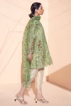 Transition effortlessly into spring with this tea-green khaddi silk printed kurta and printed organza dupatta with embroidery detailing. Paired with raw silk shalwar.