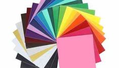 various colors of paper are arranged in a circle