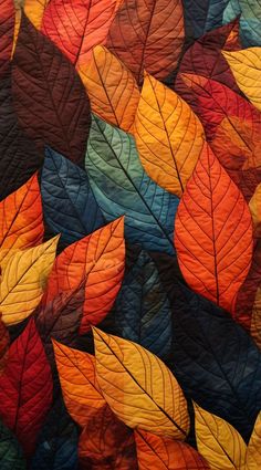 an image of colorful leaves that are on the wall in the room with it's colors