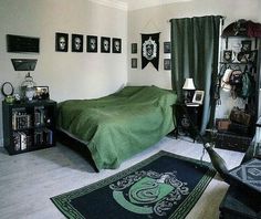 a bed room with a neatly made bed and pictures on the wall