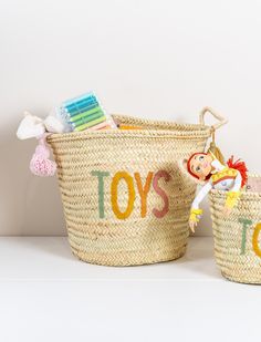 two baskets with toothbrushes and toys in them