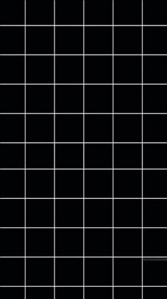 a black and white tiled wall with squares on the top, bottom and bottom half