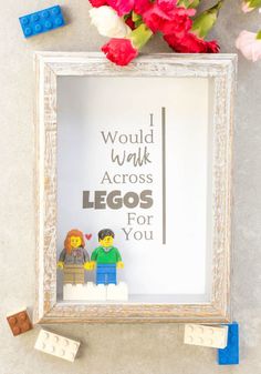 legos are placed in front of a frame with the words i would walk across legos for you