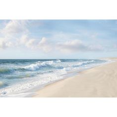 the beach has waves coming in from the ocean