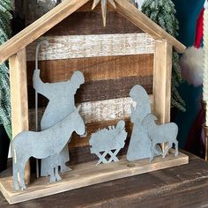 the nativity scene is made out of wood and metal