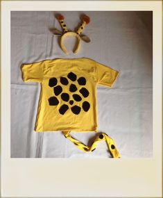 a child's t - shirt and headband made to look like a giraffe