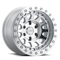 an aluminum wheel with rivets on the front and rear wheels, all in silver