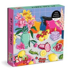 a puzzle box with flowers and fruit on it