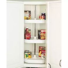 an image of a white pantry with food in the door and shelves on both sides