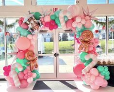 balloons are arranged in the shape of letters and numbers for an entrance to a store