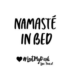 the words namaste in bed are black and white, with hearts on them