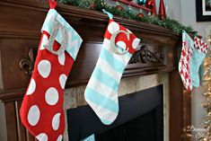 christmas stockings hanging from a fireplace mantel decorated for the holidays with red, white and blue stocking