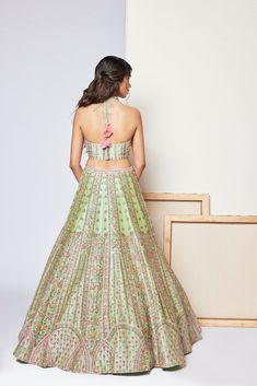 Silk based multi-hued thread embroidered lehenga paired with matching halter blouse and tulle dupattaFrom Chamee and Palak's A Hundred Flowers collection DELIVERY TIMEPlease wait 8-12 weeks for your outfit to arrive. FABRIC DETAILSDupion Silk, Tulle Professional cleaning only. Fusion Style Festive Sets With Resham Embroidery, Pista Green Choli With Floral Embroidery For Party, Pista Green Floral Embroidered Choli For Reception, Festive Fusion Lehenga For Wedding, Fusion Wedding Sets With Resham Embroidery, Pista Green Choli With Floral Embroidery For Wedding, Pista Green Wedding Choli With Floral Embroidery, Fusion Style Choli For Wedding And Navratri, Fusion Style Wedding Choli For Navratri