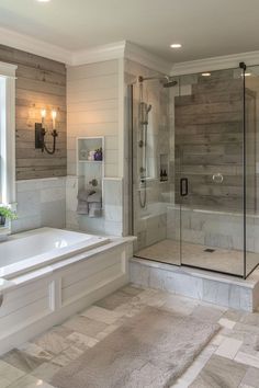 a large bathroom with a walk in shower next to a bathtub