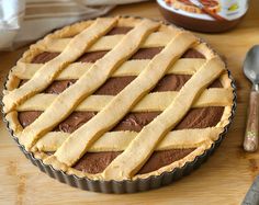 a chocolate pie sitting on top of a wooden table