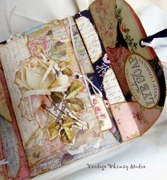 an altered book with flowers on it