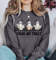 Introducing our spook-tacular Halloween Crewneck Sweatshirt, a must-have addition to your festive wardrobe! Get ready to embrace the enchanting ambiance of Halloween season while staying cozy and stylish. Whether you are wandering through haunted houses, going to work on casual Friday, or running errands, this sweatshirt is the perfect attire! This sweatshirt also makes the perfect spooky gift for yourself, family member, or friend.  SHIRT DETAILS *Classic unisex heavy blend crewneck sweatshirt. Halloween Crewneck Sweatshirt, Friend Shirt, Halloween Crewneck, Cozy Fall Outfits, Spooky Gifts, Haunted Houses, Ghost Shirt, Sweatshirt Cute, Fall Gifts