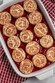 baked desserts in a white dish on a red and white checkered cloth