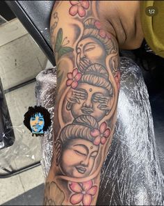 a person with a tattoo on their arm and head in the middle of his arm