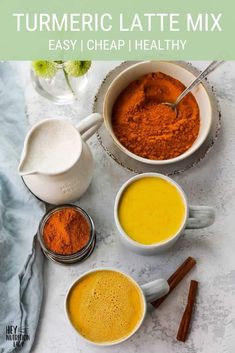 turmeric latte mix in white mugs with cinnamon sticks and spices on the side