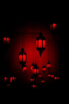 red lanterns are hanging in the dark