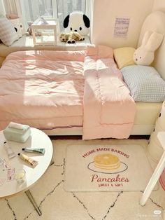 a bed room with a neatly made bed and some stuffed animals on the side tables