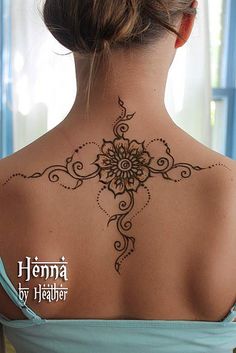 a woman with a tattoo on her back