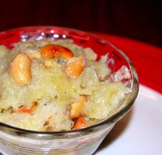 a glass bowl filled with food on top of a white plate