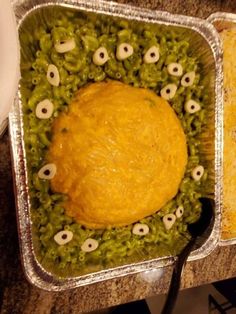 two trays filled with food on top of a counter