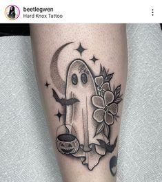 a black and white photo of a ghost with flowers on his leg, next to a coffee cup