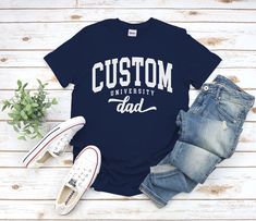 "Custom University Dad Shirt, Cool Cozy University Dad Gift Tshirt for Mens and Women available in 10 color ; Black, White Navy, Sport Grey, Royal Blue, Irish Green, Red, Natural, Military Green, Dark Chocolate. This shirt using USA standard size; S, M, L, XL, 2XL, 3XL, 4XL. Tee Spec's Using Direct to Garment (DtG) for quality and durability print. Using semi-fitted tee full cotton for cool & comfort t-shirt. * 100% ring-spun cotton * Pre-shrunk for extra durability * Shoulder-to-shoulder taping * Quarter-turned to avoid crease down the center. Size Chart S 18\" with 28\" length M 20\" with 29\" length L 22\" with 30\" length XL 24\" with 31\" length 2XL 26\" with 32\" length 3XL 28\" with 33\" length 4XL 30\" with 34\" length 5XL 32\" with 35\" length Handling time After clearing payment, Casual T-shirt With Custom Text For College, Casual College T-shirt For Father's Day, Casual T-shirt For College And Father's Day, Casual Custom Text T-shirt For College, Customizable Cotton T-shirt For College, Casual College T-shirt With Custom Text, Fitted Tee, The A Team, Green Dark