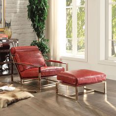 a red leather chair and ottoman in a living room