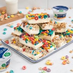 some kind of dessert that is on top of a table with cereal and ice cream